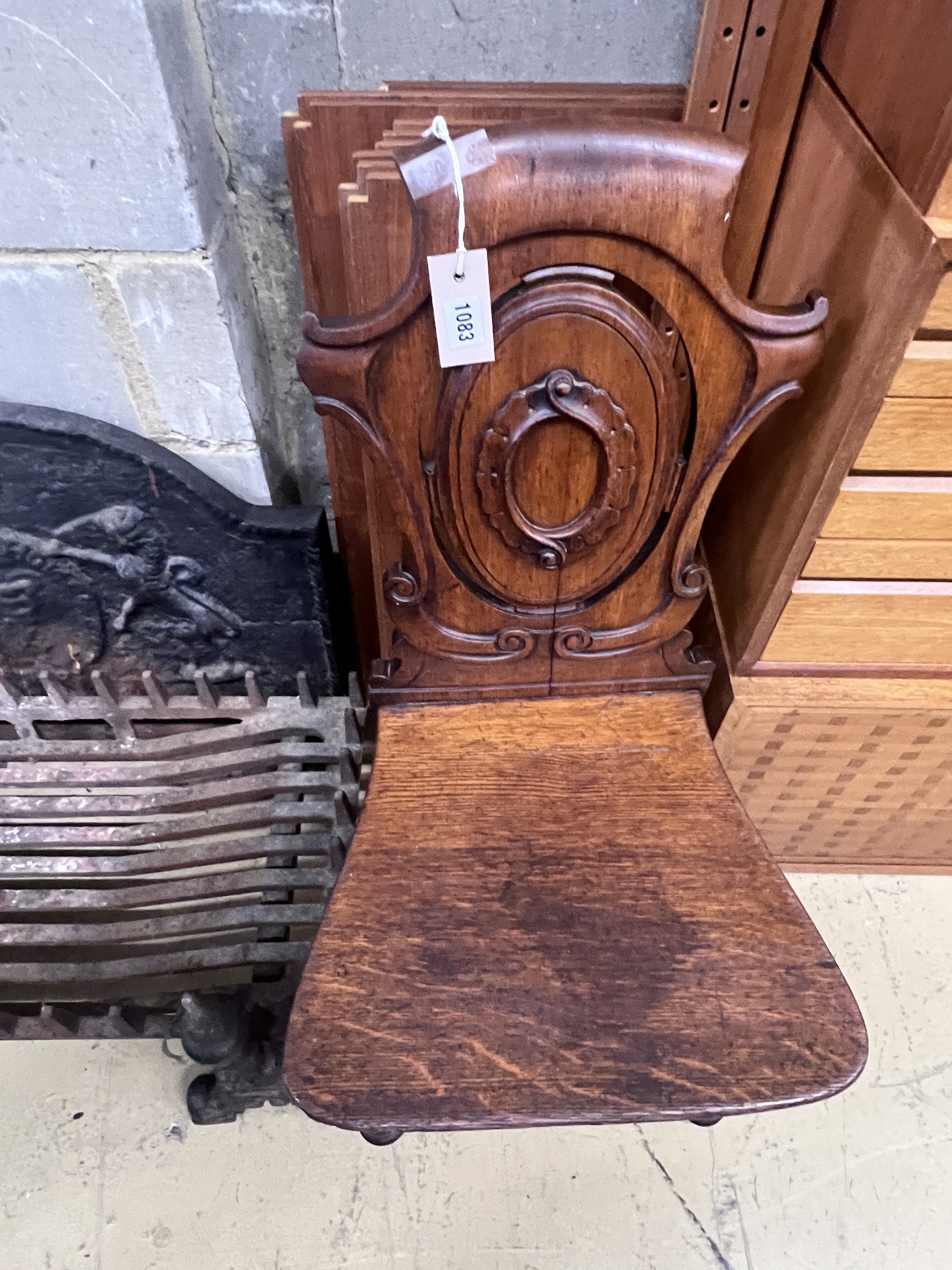 A Victorian oak hall chair